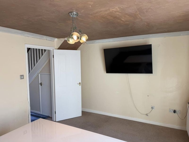 The living room from the other side, ceiling skimmed with new coving