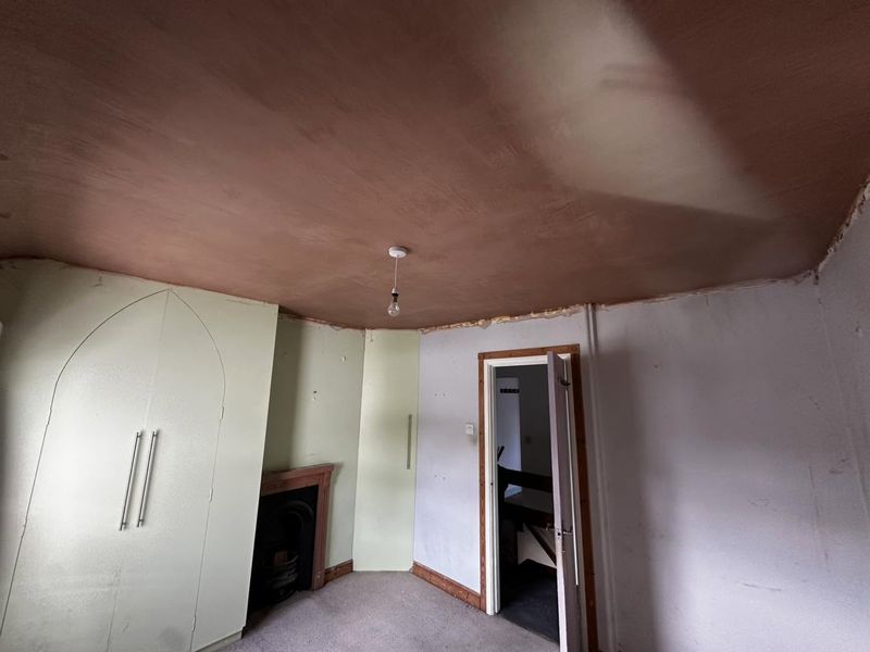 The same side of the bedroom with the new ceiling skimmed