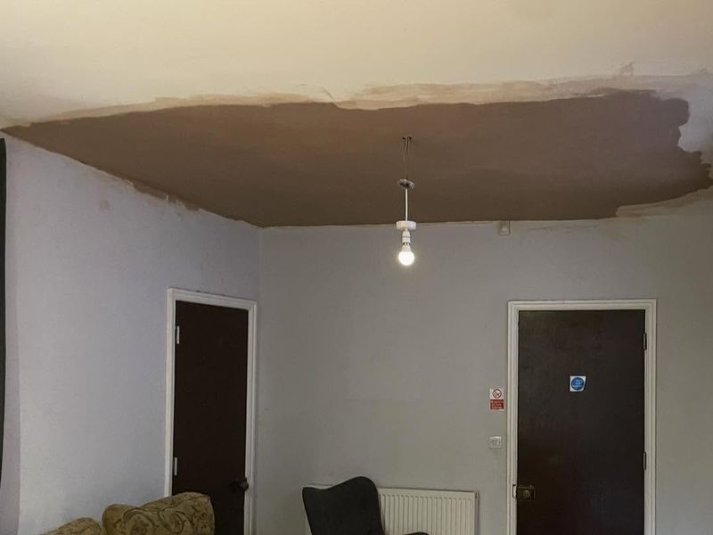 The repaired section of ceiling skimmed in fresh plaster